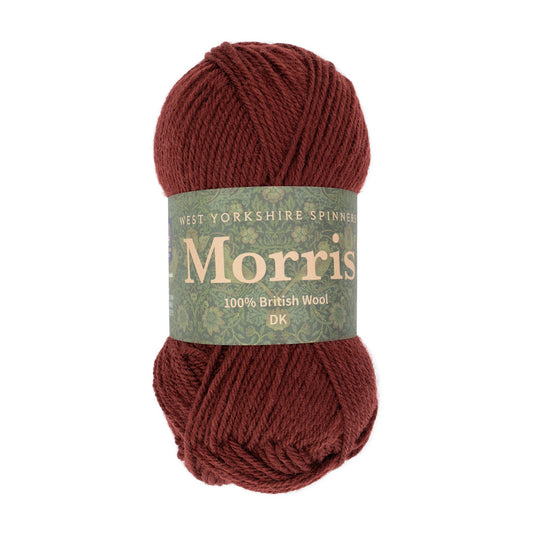 Red skein of yarn with a label on a white background